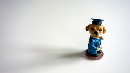 Canine police officer figurine on a white background, studio shot