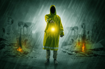 Destroyed place after a catastrophe with man in raincoat and lantern concept
