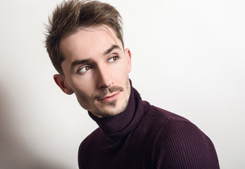 Fototapeta premium Handsome young elegant man in violet golf.