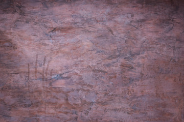 Abstract wall fragment stucco with scratches and cracks .Texture of painted  brown old grunge concrete wall for background