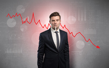 Young sick businessman with decreasing performance concept
