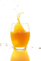 Fototapeta na wymiar Single glass of orange juice on white background