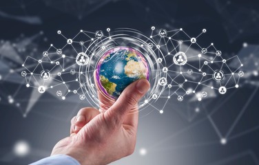 Businessman holding globe with social media network icons structure