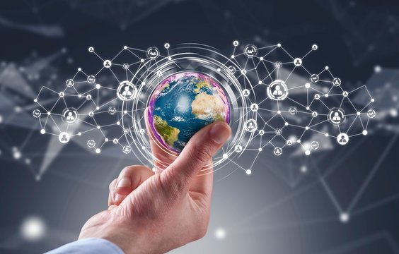 Businessman holding globe with social media network icons structure - Powered by Adobe