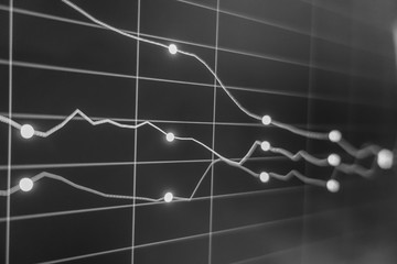 Stock exchange market in black and white on LED screen. Finance and economic concept.