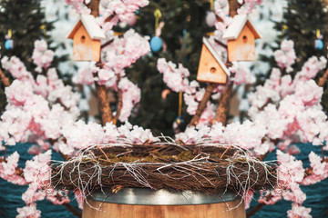 Nest on the background of blooming Easter trees