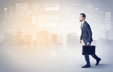 Handsome businessman walking in suit with briefcase on his hand and database concept around
