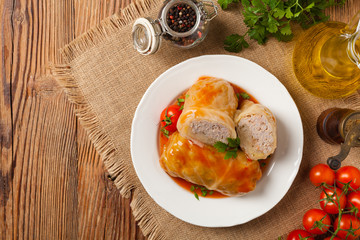 Traditional stuffed cabbage with minced meat and rice, served in a tomato sauce.