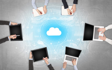 Group of people with devices in hands working on reports with online teamwork and cloud technology...