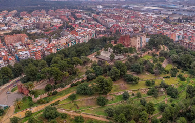Fototapeta premium Aerial view of Castelldefels, popular Costa Brava Spanish beach town with modern buildings and hilltop medieval castle near Barcelona