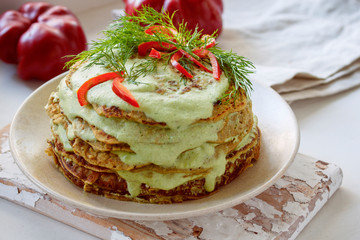 lentil cake with spinach, bell pepper, greens and cashew sauce. Vegan Festive Dish