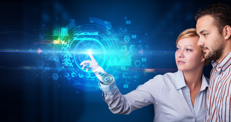 Man and woman touching hologram screen displaying medical symbols and charts
