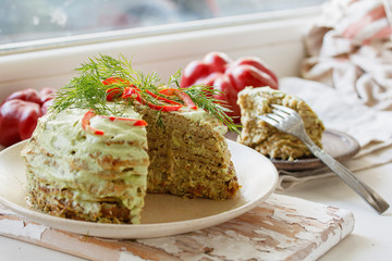 lentil cake with spinach, bell pepper, greens and cashew sauce. Vegan Festive Dish