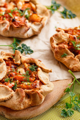 Vegetable biscuit with cabbage, carrots, onions and mushrooms, decorated with greens