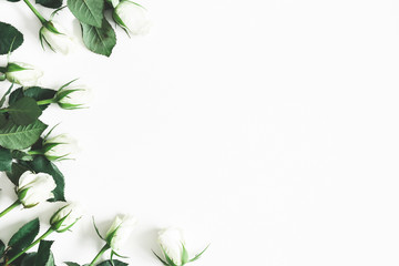 Flowers composition. White rose flowers on white background. Flat lay, top view, copy space - obrazy, fototapety, plakaty