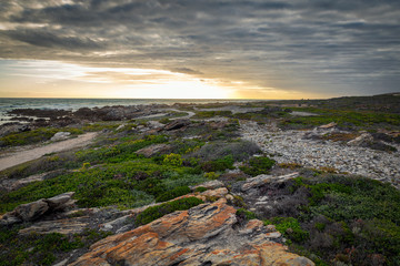 Fototapeta na wymiar Beatiful sunset at Cape Agulhas, southernmost point of Africa
