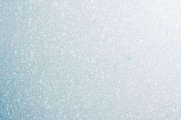 Frozen winter abstract background on the window glass with copy space