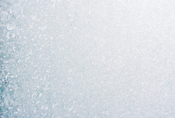 Frozen winter abstract background on the window glass with copy space