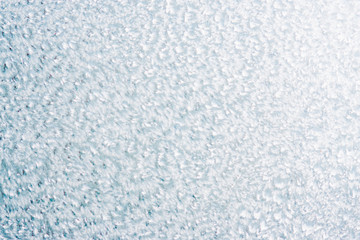 Frozen winter abstract background on the window glass with copy space