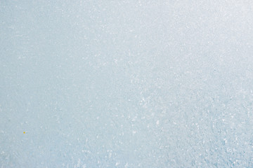 Frozen winter abstract background on the window glass with copy space