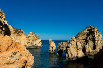 Beautiful panoramic sea view over rocks and cliffs in the Atlantic Ocean at Ponta da Piedade, Algarve region, Portugal