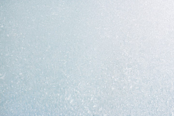 Frozen winter abstract background on the window glass with copy space