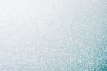 Frozen winter abstract background on the window glass with copy space