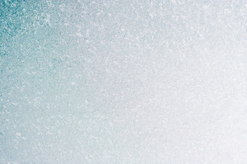 Frozen winter abstract background on the window glass with copy space