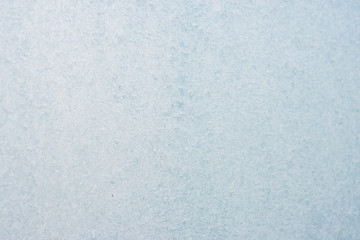 Frozen winter abstract background on the window glass with copy space