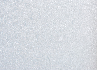 Winter background with gleaming ice. Frozen water texture. Copy space