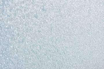 Obraz premium Winter background with gleaming ice. Frozen water texture. Copy space
