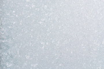 Obraz premium Winter background with gleaming ice. Frozen water texture. Copy space.