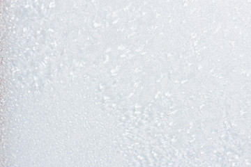 Ice background, frozen water with glass. Winter texture. Copy space.