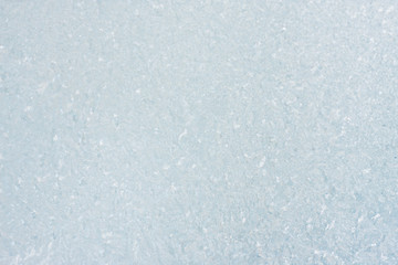 Ice background, frozen water with glass. Winter texture. Copy space.