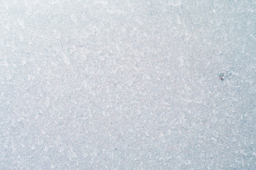 Frozen winter abstract background on the window glass with copy space
