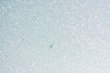 Frozen winter abstract background on the window glass with copy space