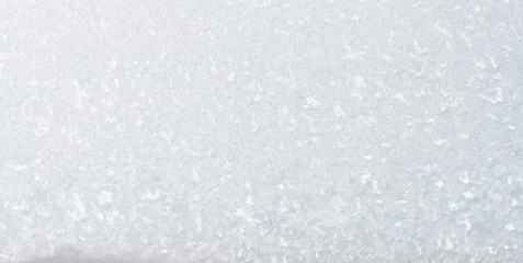 Frozen winter abstract background on the window glass with copy space