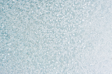Frozen winter abstract background on the window glass with copy space