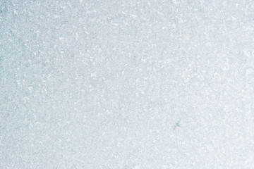 Frozen winter abstract background on the window glass with copy space