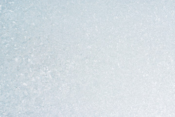 Frozen winter abstract background on the window glass with copy space