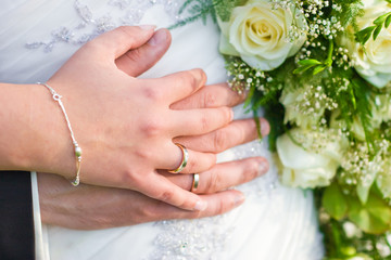 Obraz na płótnie Canvas Newlyweds with wedding rings