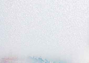 Frozen winter abstract background on the window glass with copy space