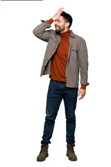 Naklejka premium Full-length shot of Handsome man with beard has just realized something and has intending the solution on isolated white background