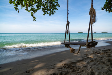 Seascape, rope swing on the beach Lonely Beach, Koh Chang island, Thailand.