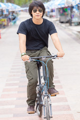 Guy and bicycle in the park