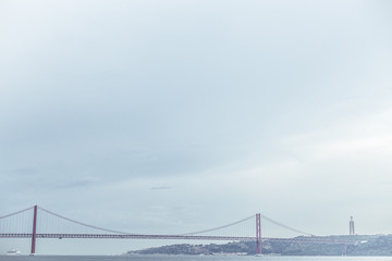 Fototapeta premium General view of red April 25 Bridge in Lisbon Portugal