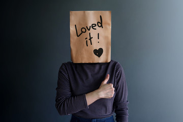 Customer Experience or Human Emotional Concept. Woman Covered her Face by Paper Bag and present...
