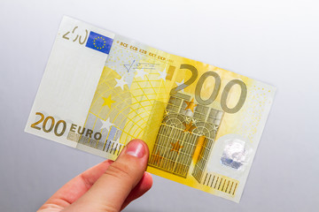 200 Euro money cash note in hand isolated on white 