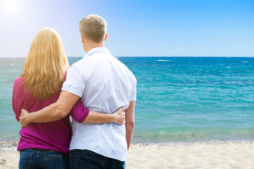 Couple Standing At Tropical Beach