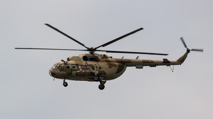 military helicopter in flight